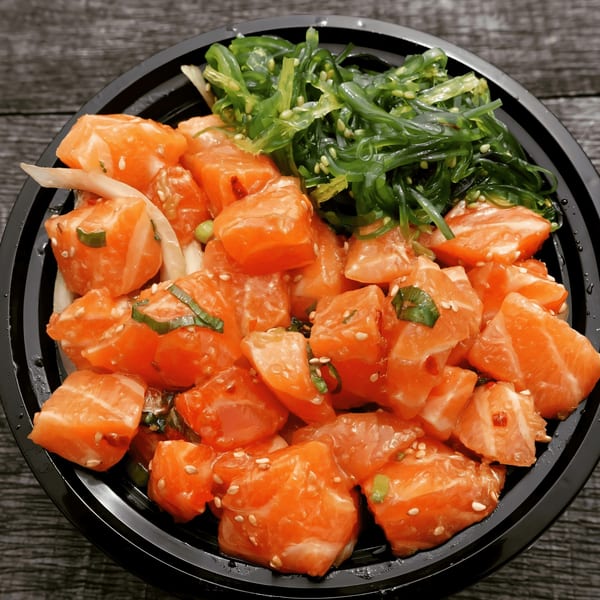 Ali'i Hawaiian Grill's poke bowl with fresh salmon, seaweed salad, and sesame seeds.